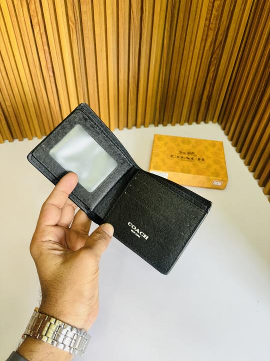 BLIPBOP 01 COACH premium quality wallet in classic leather with multiple card slots and a sleek design.